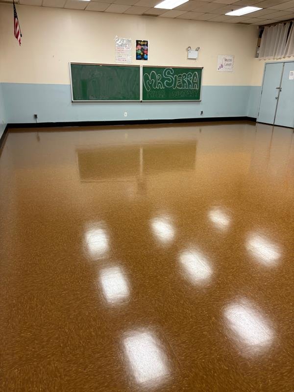 Classroom with newly installed glossy resilient flooring
