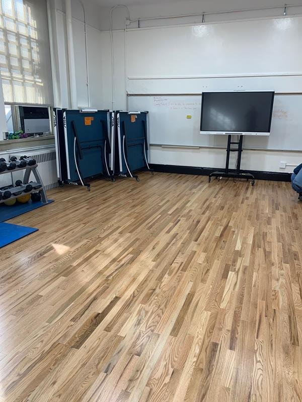 School fitness room with new red oak strip flooring