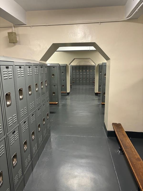Jamaica High School locker room with new steel lockers under arched openings